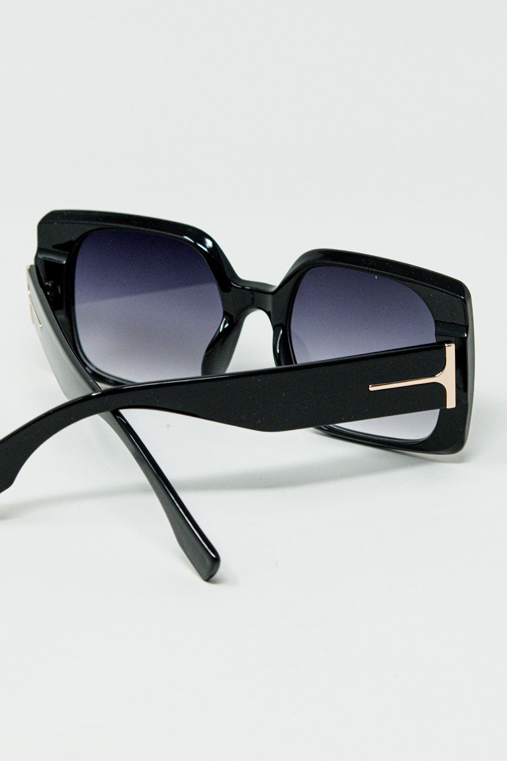 Black square sunglasses with gold detail on the side | Just Cool Beans