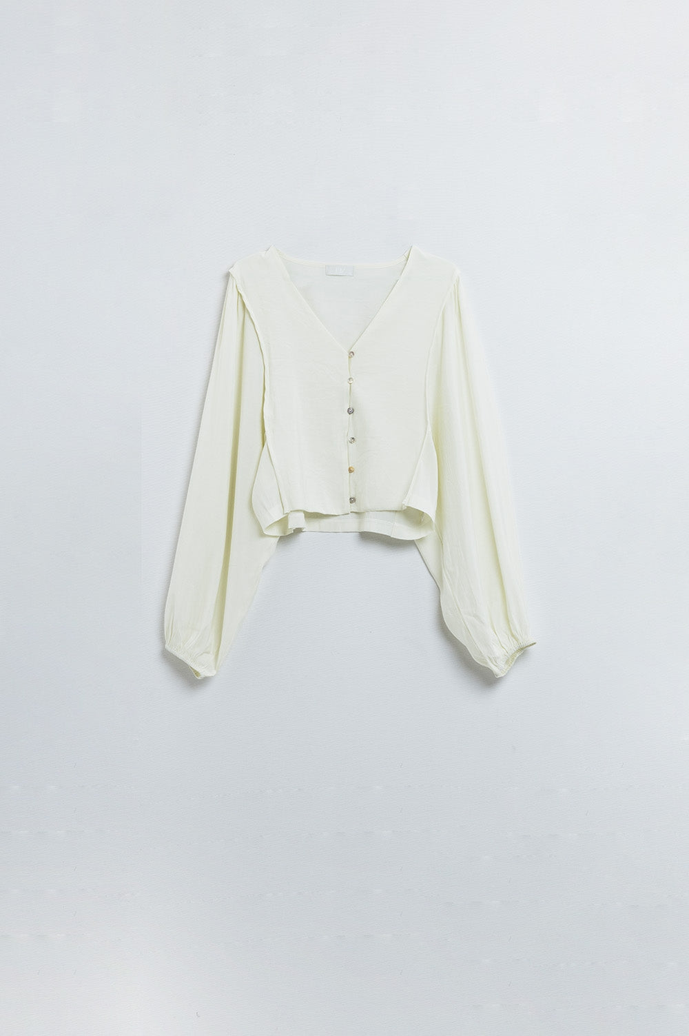 Cream blouse with balloon sleeves and frontal closure with buttons | Just Cool Beans — sweaters | tops