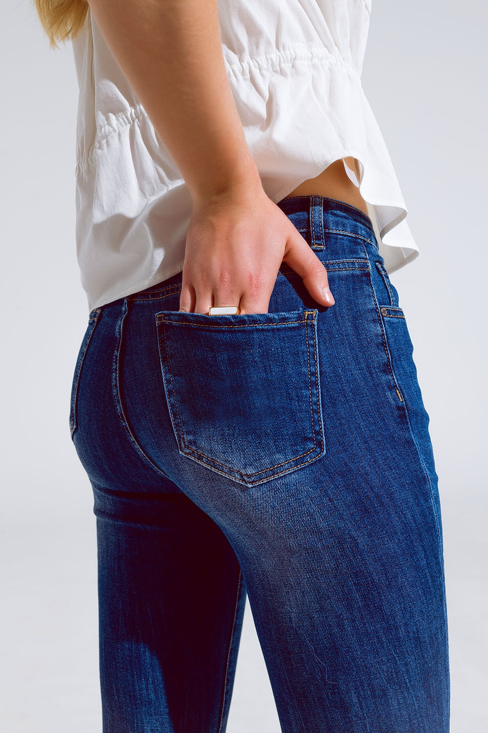 Flared skinny jeans with raw hem edge in mid wash | Just Cool Beans