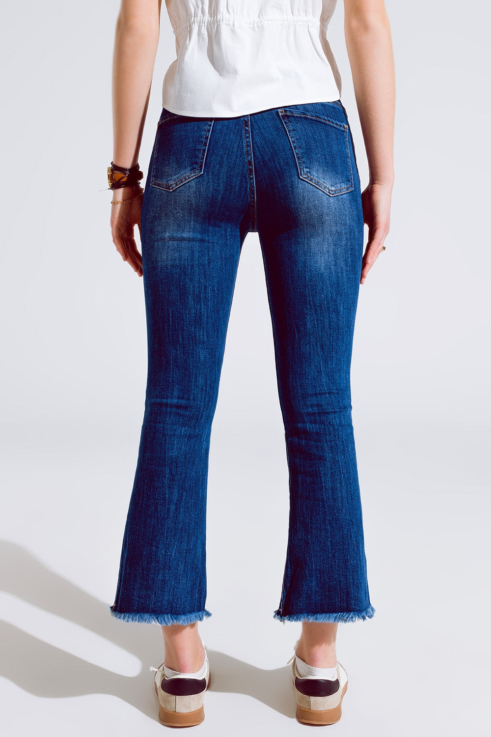 Flared skinny jeans with raw hem edge in mid wash | Just Cool Beans