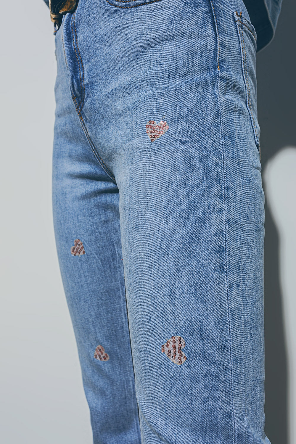Heart embellished jeans with teared hem in med wash | Just Cool Beans