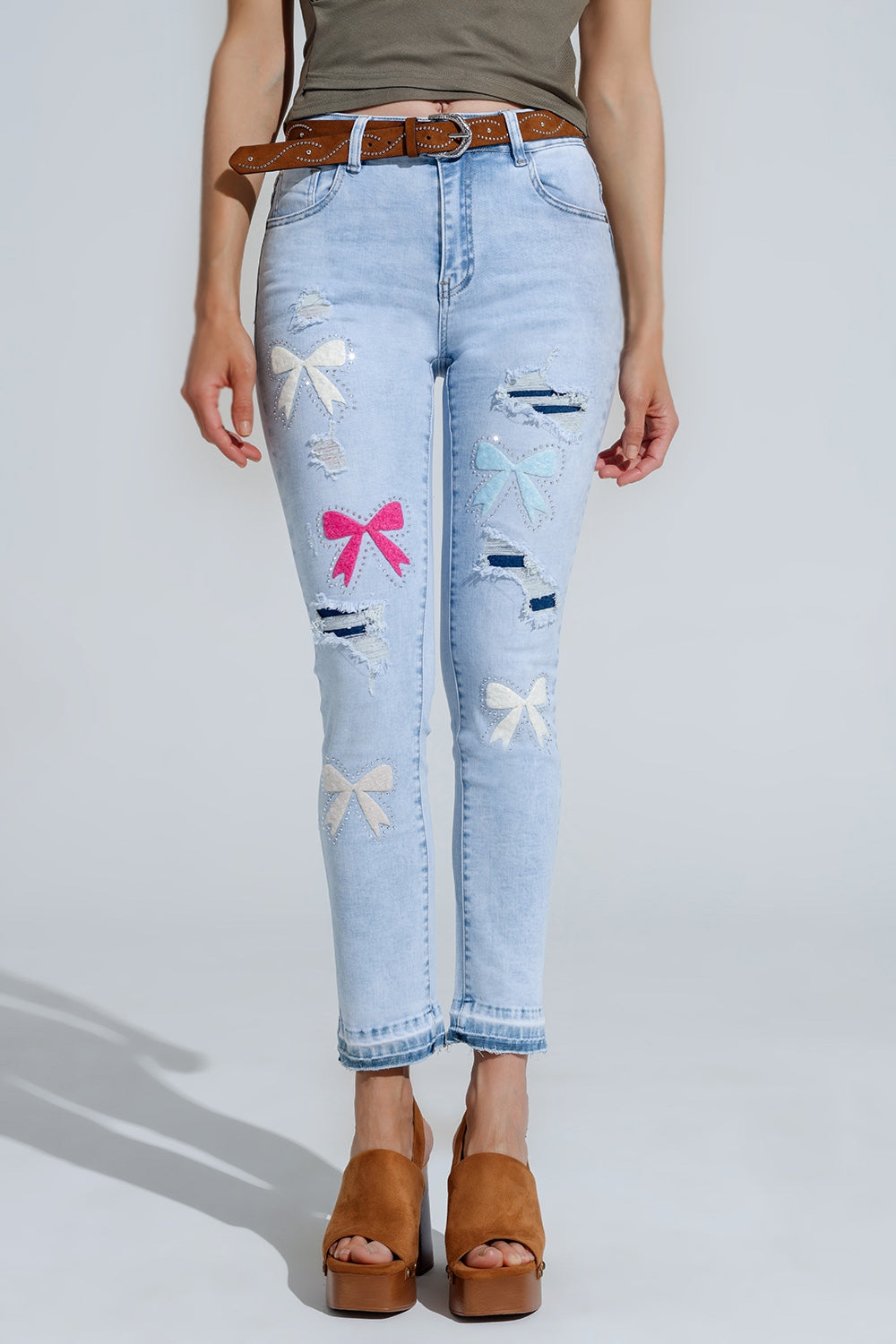 Light blue super skinny jeans with bow ties and ripped holes | Just Cool Beans — jeans | the denim shop