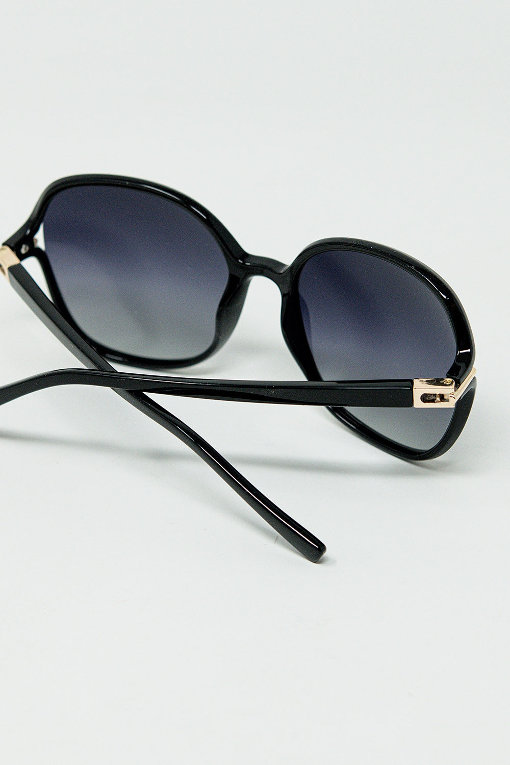 Round sunglasses in black with gold metal detail | Just Cool Beans