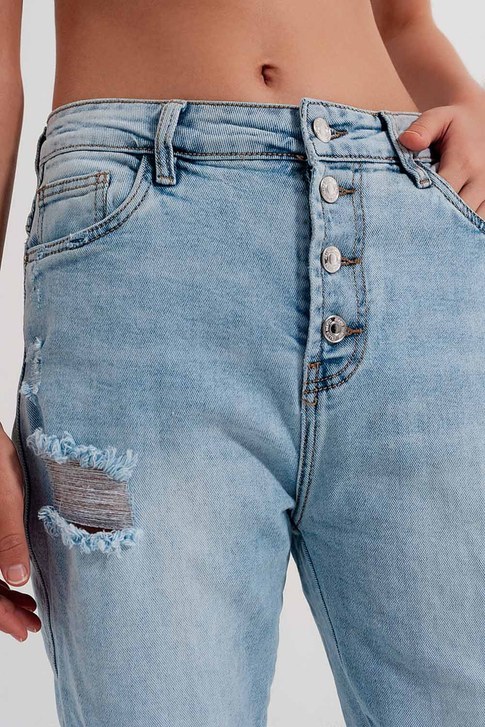Straight leg distressed jeans with button detail in light blue | Just Cool Beans
