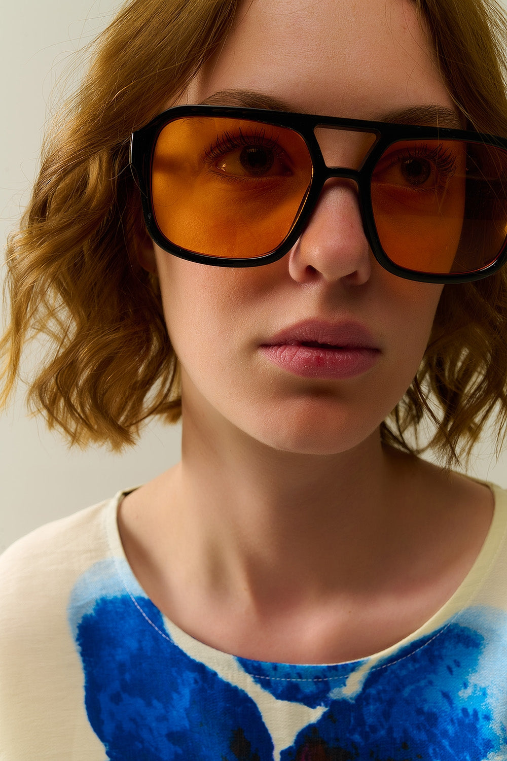 Sunglasses with black frames and orange lenses | Just Cool Beans