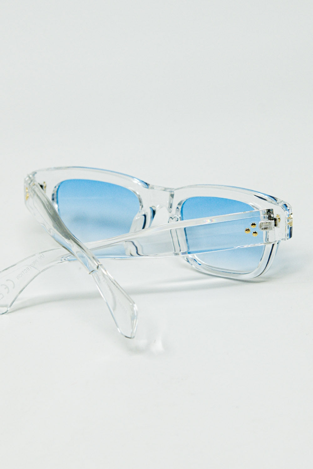 Translucent white sunglasses with oval light blue lenses | Just Cool Beans