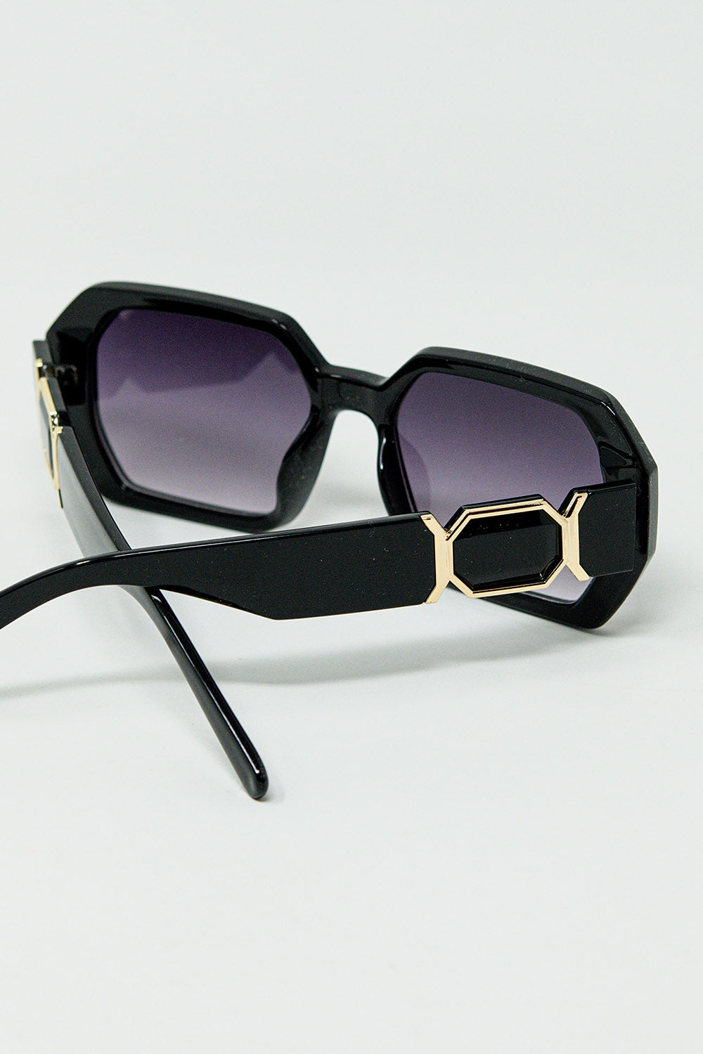Black diamond-shaped sunglasses and goldden detail | Just Cool Beans