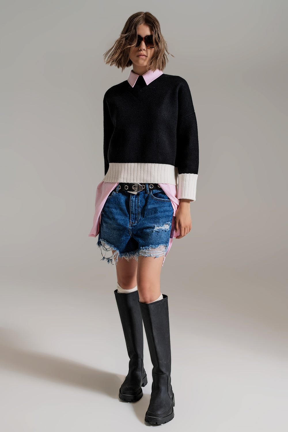 black jumper with white ribbed cuffs and hem