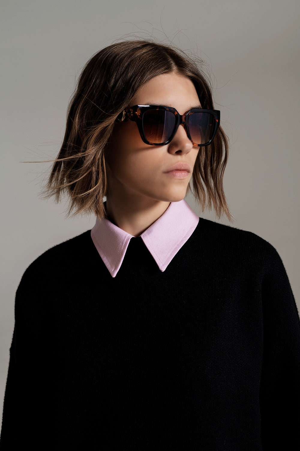 black jumper with white ribbed cuffs and hem
