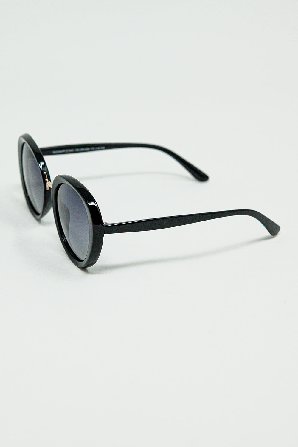 Black oval shaped sunglasses with metal gold detail | Just Cool Beans