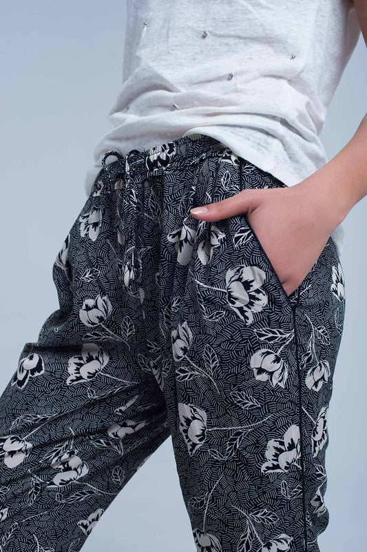 Black pants with floral print | Just Cool Beans — pants | bottoms