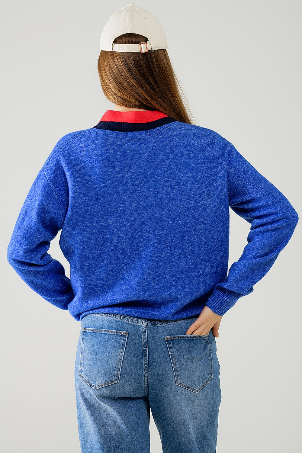 Blue sweater with contrasting collar and love logo on chest