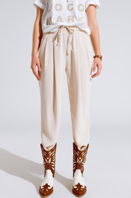 Pants in beige with front pockets and drawstring closing | Just Cool Beans — pants | bottoms