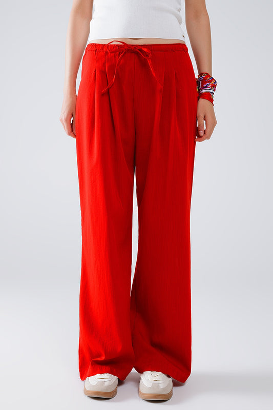 Red relaxed pants with drawstring closing and side pockets | Just Cool Beans — pants | bottoms