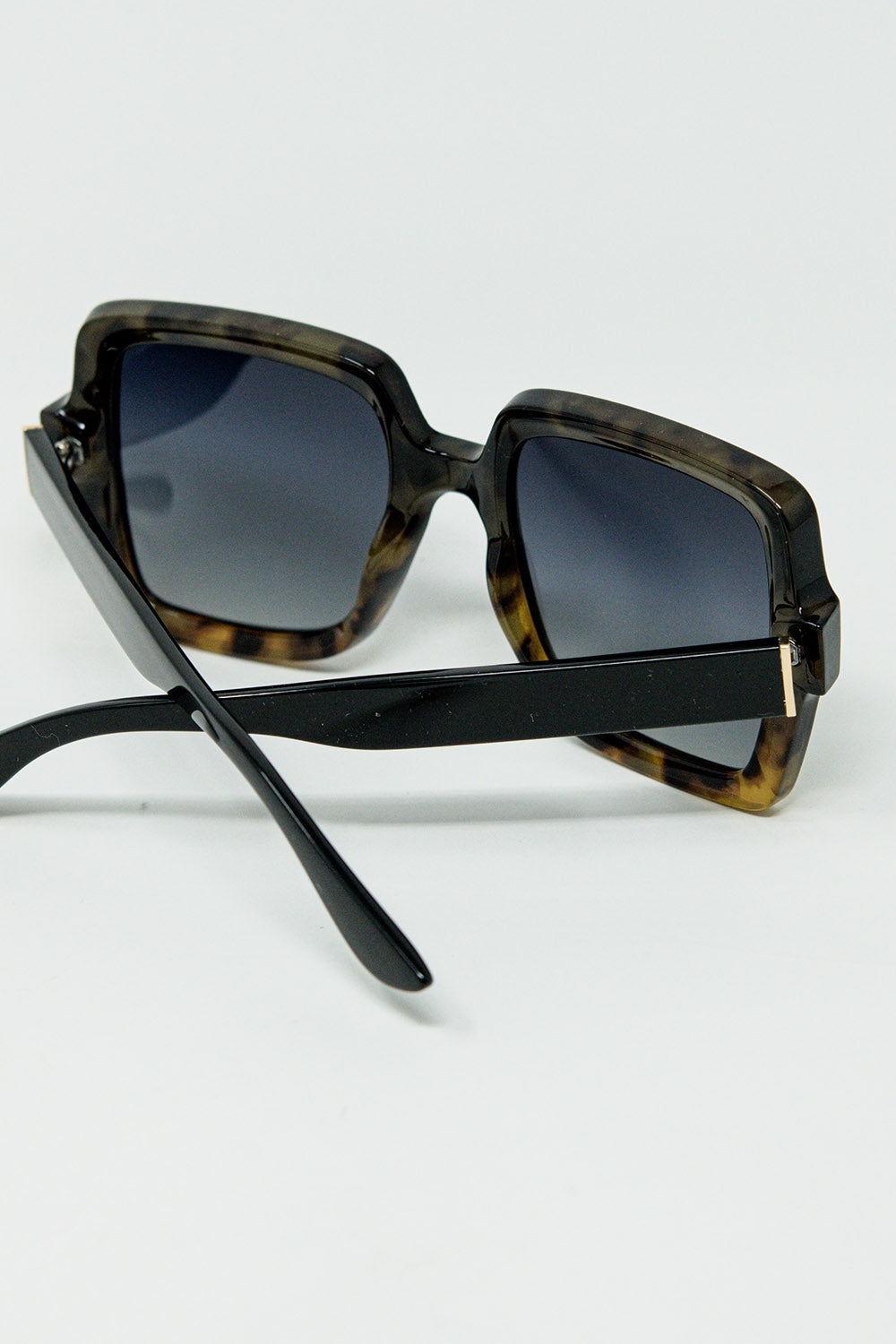 Sunglasses with a gradient print frame and black temples | Just Cool Beans