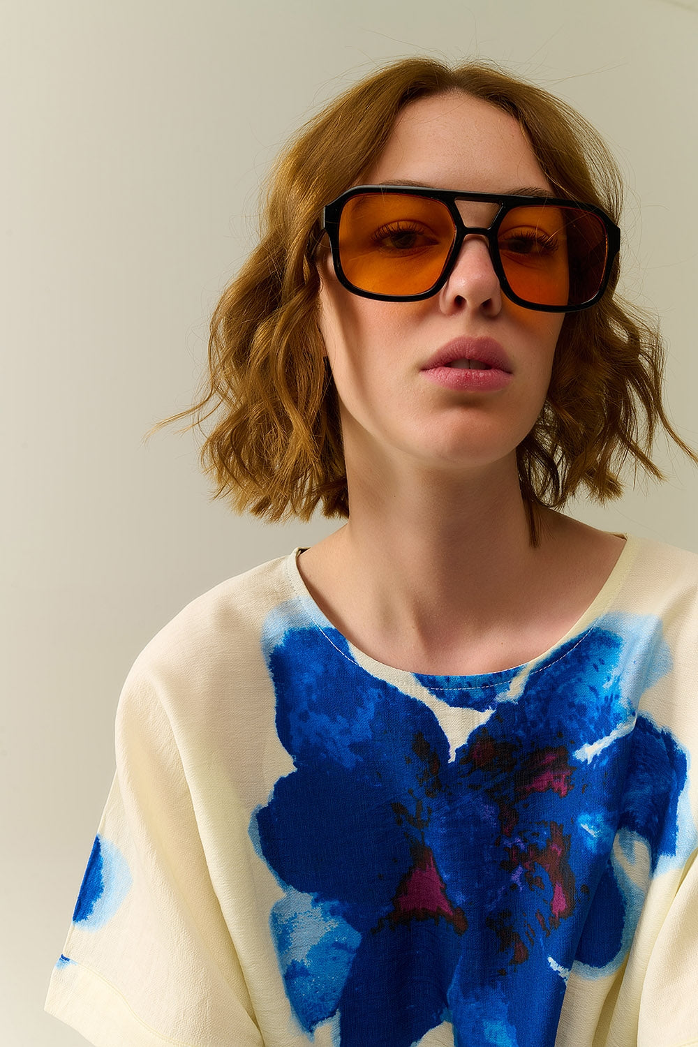 Sunglasses with black frames and orange lenses | Just Cool Beans