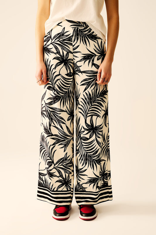 Wide leg pants in white with floral detail in black | Just Cool Beans — pants | bottoms