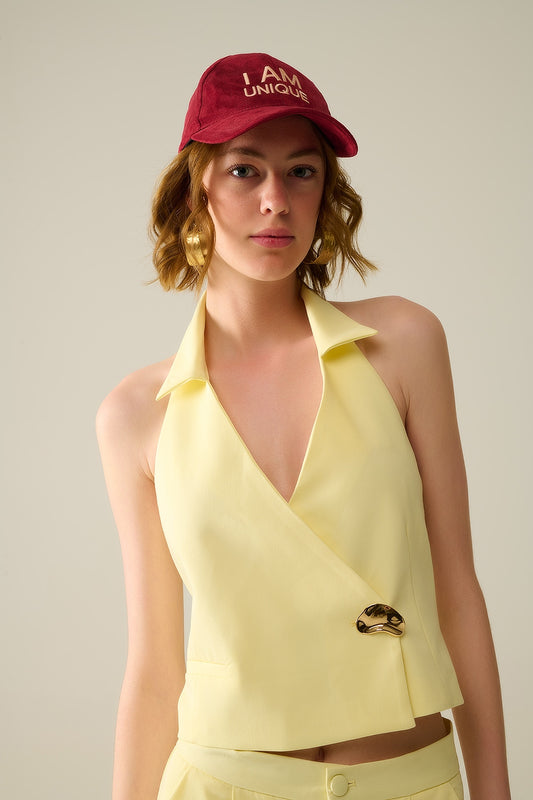 Yellow wrap vest with detailed gold button | Just Cool Beans — tops